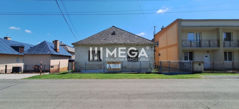 A family house in Kochanovce on Kochanovce Street with fencing and a garden.
