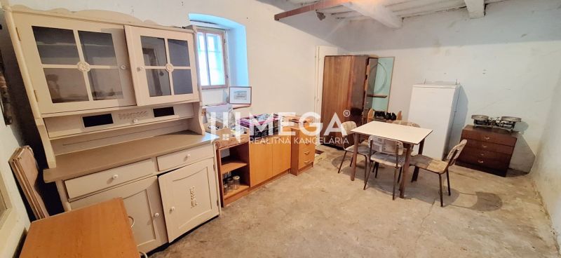 Interior of a family house with retro furniture, a console, a table, and chairs.