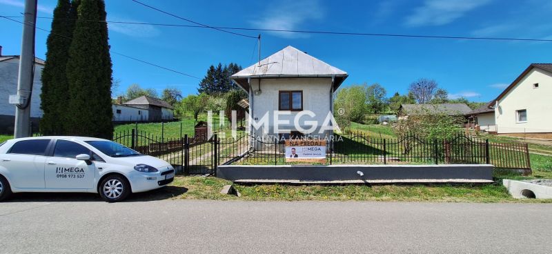 A family house in Zbudská Belá in Zbudská Belá with a white car in front of the gate.