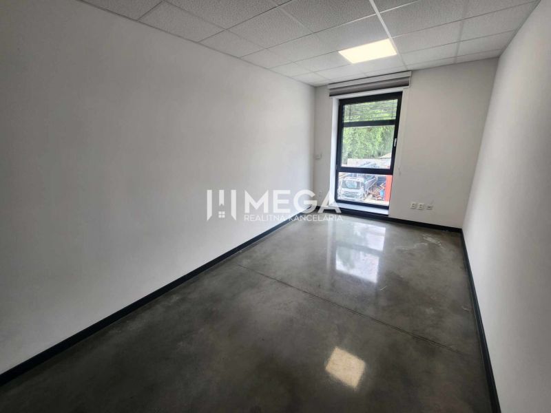 Offices with a large window and concrete floor, space on Strojnícka Street in Prešov.