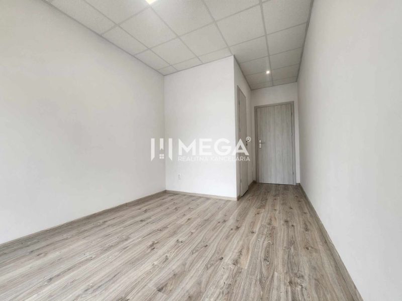 Offices with wood-patterned flooring and white walls.