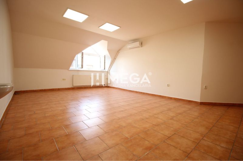 Commercial premises with ceramic flooring, air conditioning, and a large window.