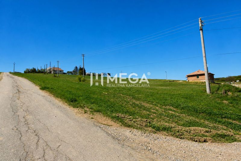 Plots - housing in Víťazovce with a vast meadow and an unmaintained asphalt road.