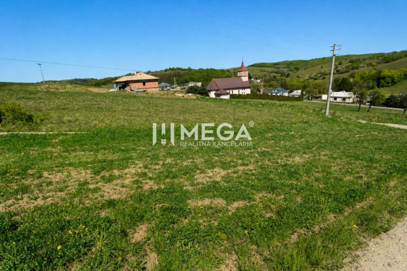 Plots - housing in Víťazovce with a church in the background, an ideal location for construction.