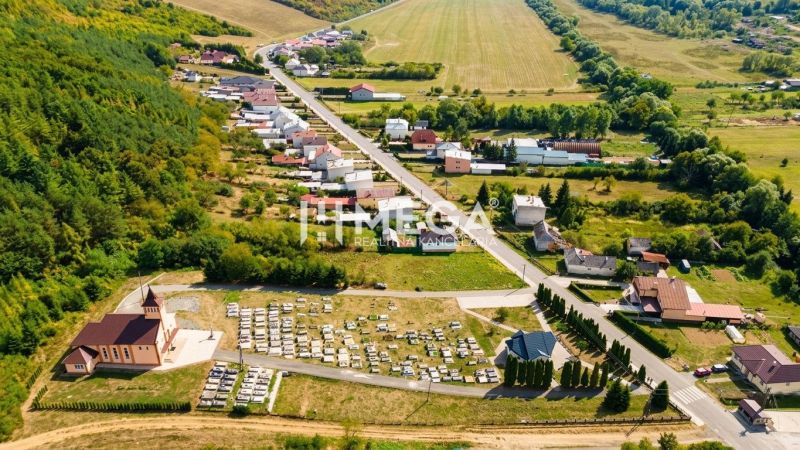 Aerial view of plots - housing in Slovenská Volová, surrounded by greenery and roads.