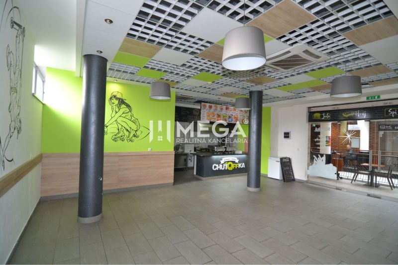 Interior of commercial spaces with decoration and a fast food counter.