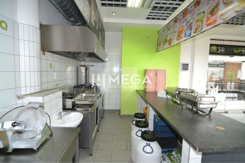 Kitchen equipment and kitchen unit with a sink in commercial premises.