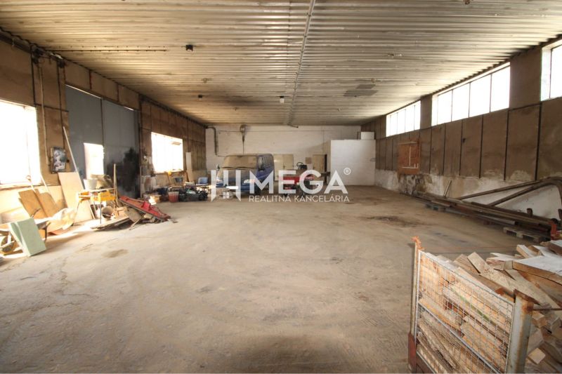 Warehouses and halls with tools and vehicles, concrete floor.