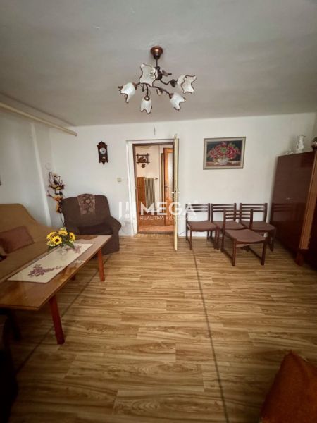 Living room in a family house with a wooden decor floor and furniture.