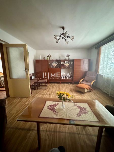 Living room in a family house with a wooden decor floor and antique furniture.