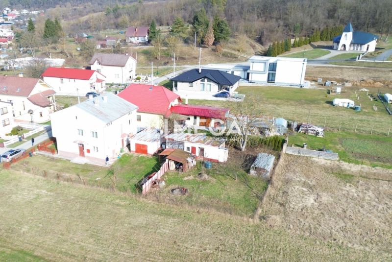 A family house in the village of Myslina on Myslina Street with a rural surroundings and a garden.