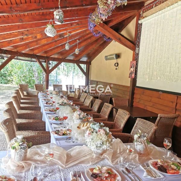 Interior of dining spaces with a set table and decorations in light shades.