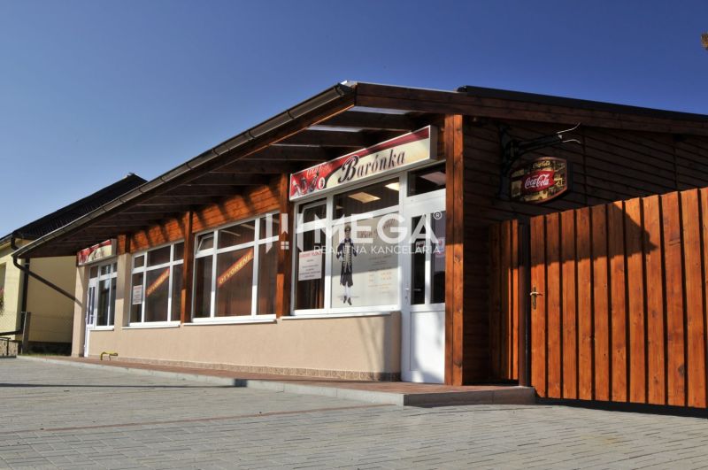 Gastro premises on Budovateľská Street in Vranov nad Topľou with wooden exterior cladding.