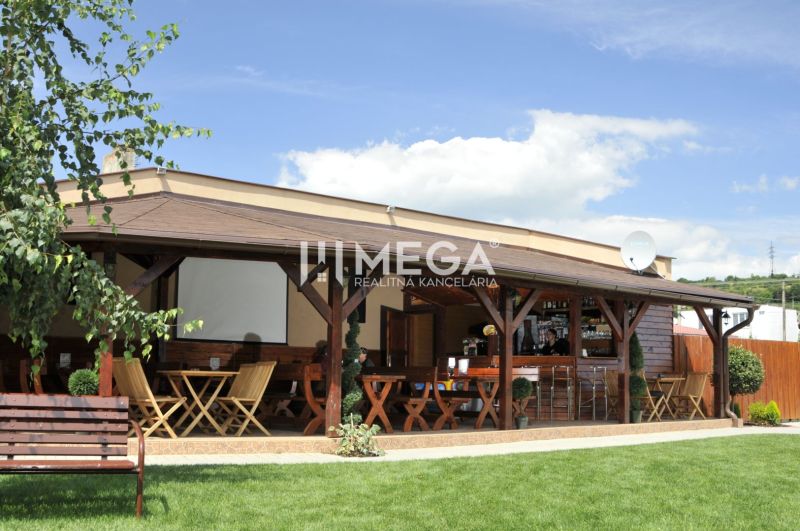 Gastro premises on Budovateľská Street in Vranov nad Topľou with garden seating.