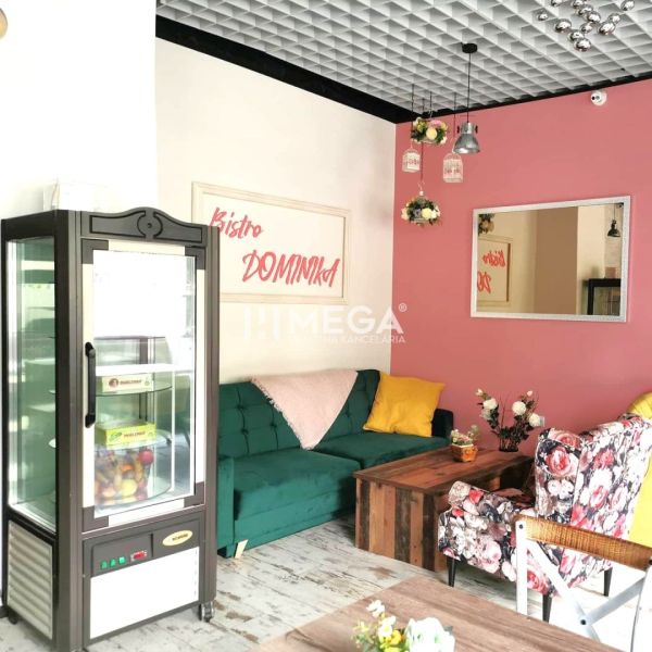 Gastro premises with colorful chairs, a mirror, and a floor with a wooden decor.