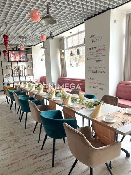 A restaurant with creative decorations, a surface with wooden decor, and arranged table settings.