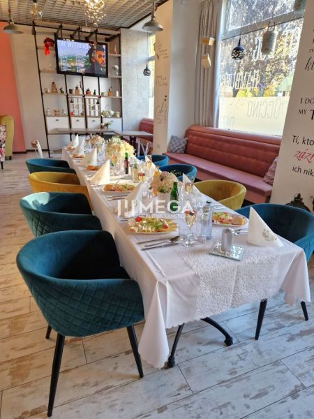 Stylish gastro spaces with decorative decorations, wooden decor flooring, and elegant chairs.