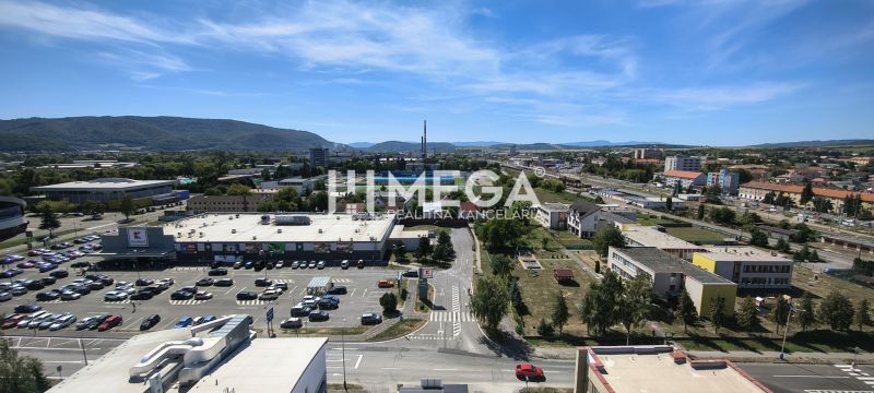 Aerial view of a part of Humenné on Štefánikova Street, offices and a supermarket.