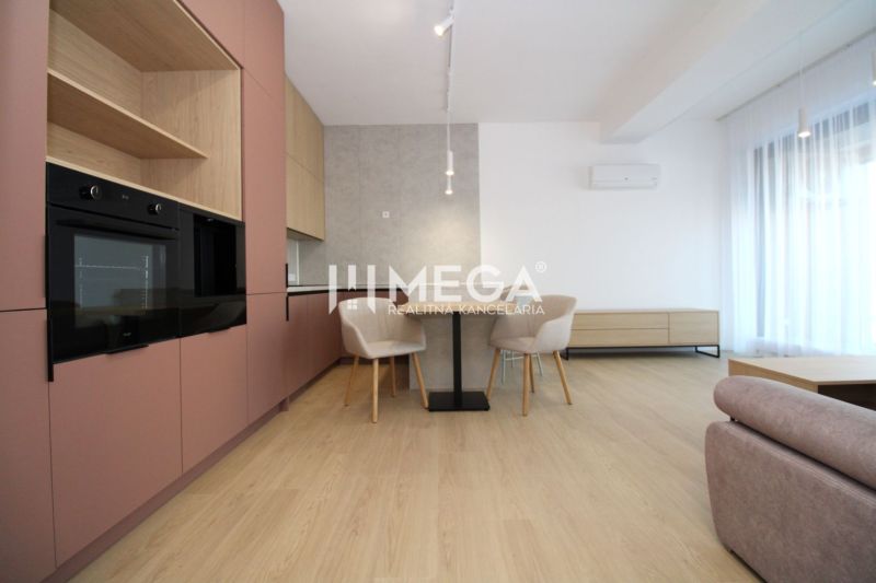 A kitchen in a 3-room apartment with a table, cream chairs, and a floor with a wooden decor.