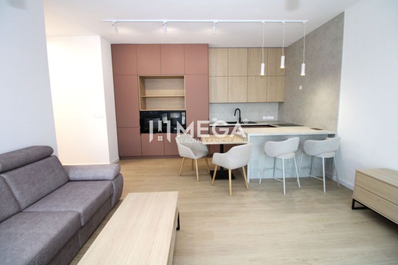 Living room with a kitchenette, floor with wood decor, 3-room apartment.