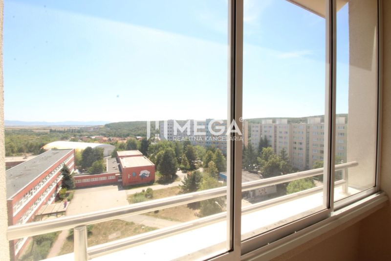 View from the loggia on Drábova Street in Košice II, surrounded by greenery and buildings.