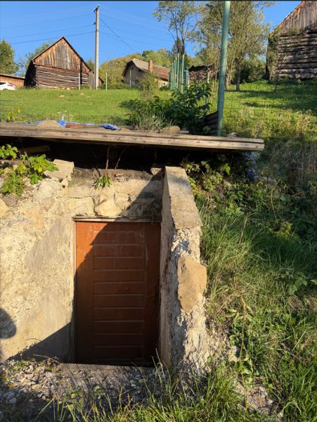 Stone entrance to the cellar on residential plots in the village of Košecké Podhradie.