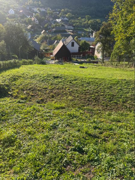 Košecké Podhradie offers residential plots with rural architecture and surrounding greenery.