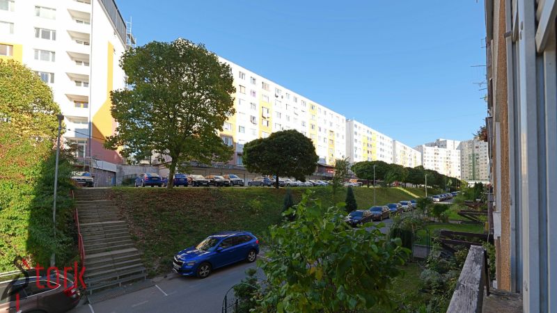 Rozkvet housing estate in Považská Bystrica with apartment buildings and parked cars.