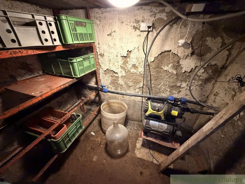 Storage space with shelves and plastic crates in the cabin.
