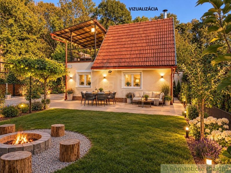 A cottage in Nové Zámky with a terrace, a fire pit, and garden lighting.