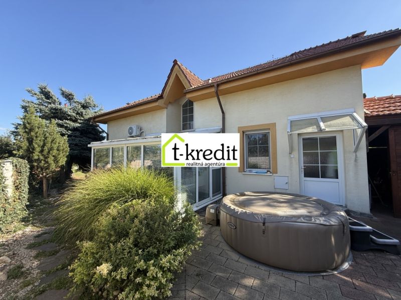A family house in Zlaté Moravce with a terrace, hot tub, and well-maintained garden.