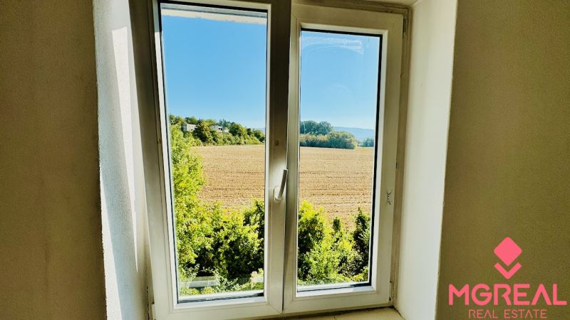 View from a one-room apartment to the field and greenery in Malé Kršteňany.