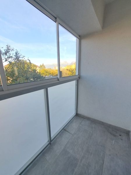 A glazed balcony of a 2-room apartment with a view of the forests in Poprad on Štúrova Street.