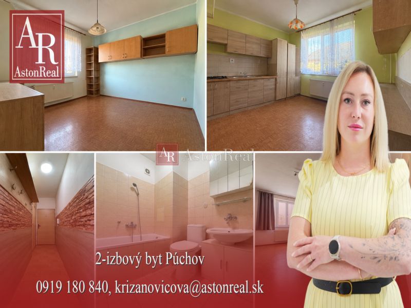 Interior of a 2-room apartment with a wooden decor floor and a light kitchen.