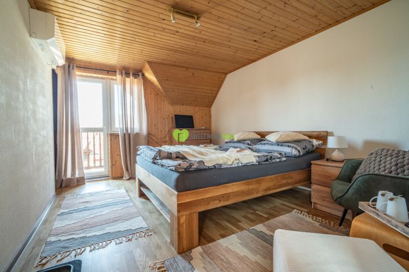 A room with wooden paneling and a floor with a wooden decor in hotels and guesthouses.