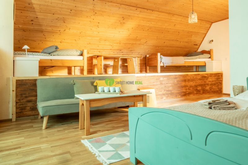 Interior in hotels and guesthouses with wood decor flooring and wood paneling.