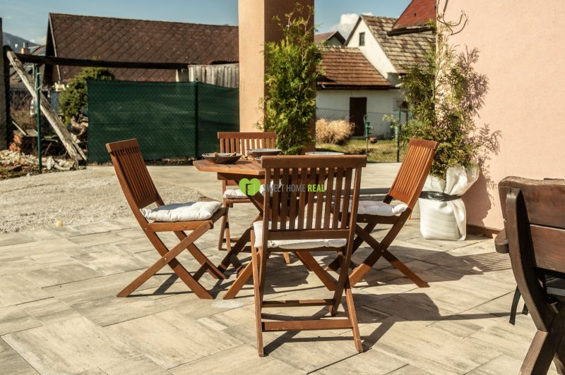 Terrace with wooden furniture in Hotels and Guesthouses in Liptovský Michal.