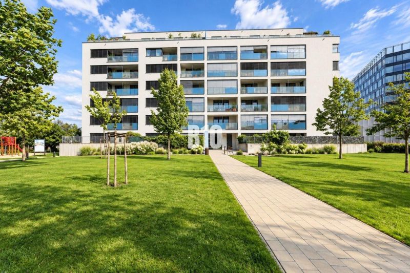 A building with modern balconies, surrounded by greenery on Malokrasňanská Street in Bratislava III.
