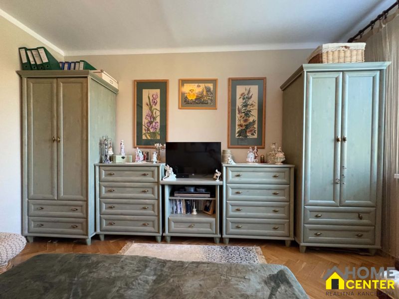 Living room with traditional furniture and decorations in a 3-room apartment.