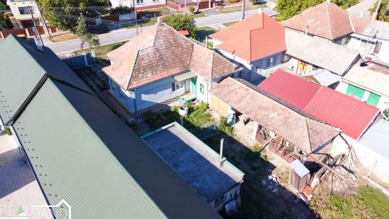 A family house in Kráľov Brod with traditional roofs and a yard in the surrounding development.