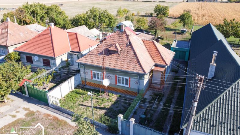 A family house in Kráľov Brod with a traditional roof, surrounding gardens and fields.