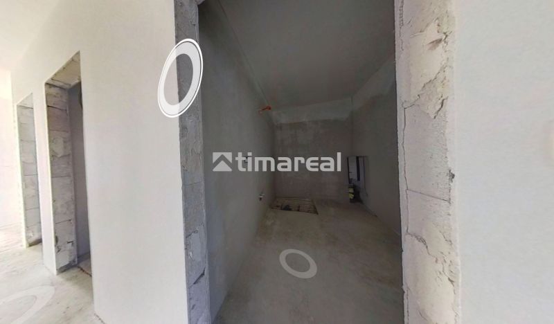 Interior of a family house with plastered walls and built-in openings for installations.