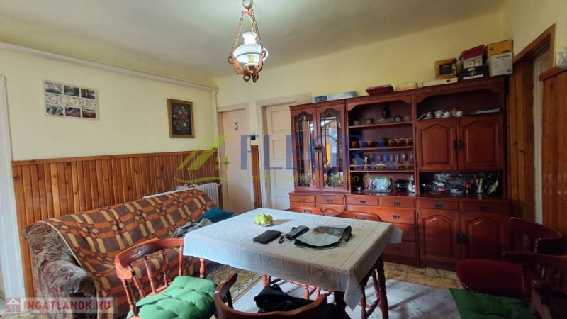 Living room in a family house with wooden decor and furniture.