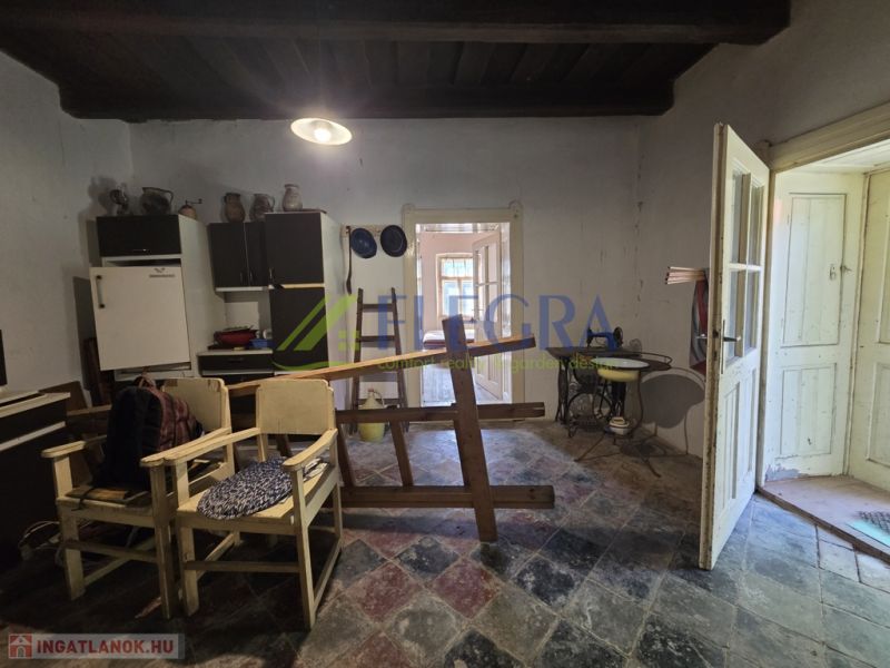 The interior of a family house with simple furnishings and a rustic atmosphere.