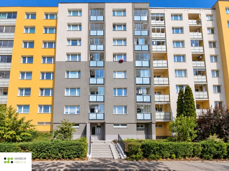 Apartment building on Bucharest Street, Košice - Sídlisko Ťahanovce district with a front garden.