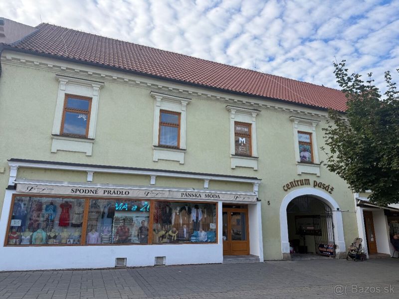 Commercial premises in Topoľčany with a textile assortment and entrance to the center of the passage.