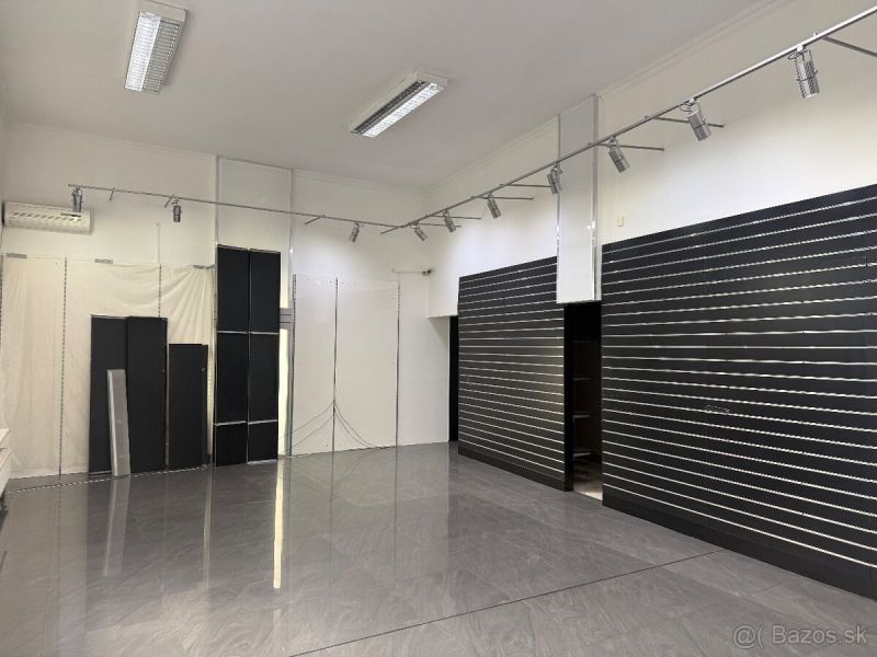 Commercial spaces with wood-effect flooring and adjustable lighting.