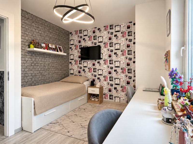 Children's room with brick cladding, a single bed, and a desk in a family house.