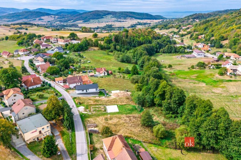 Hilly landscape surrounds the houses in Detva, ideal for residential plots.