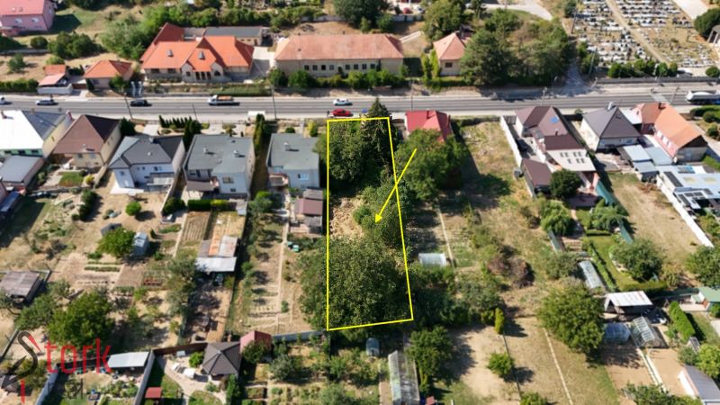 A residential plot on Štefánikova Street in Krušovce with a garden and trees.